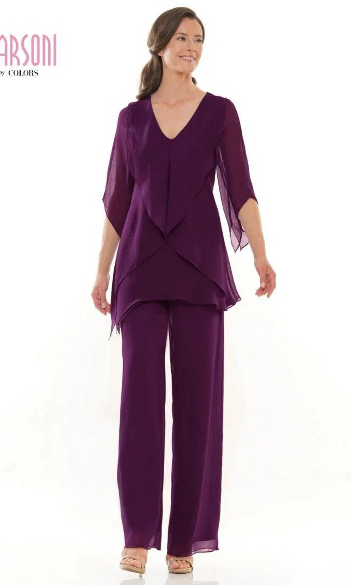 A woman models the Marsoni M308 Long Formal Pantsuit in eggplant, featuring a V-neck chiffon top and wide-leg pants, posed against a plain white background.